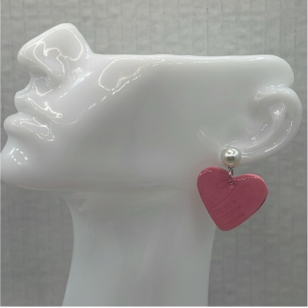 Handmade polymer clay pink hand heart earrings with white pearl.